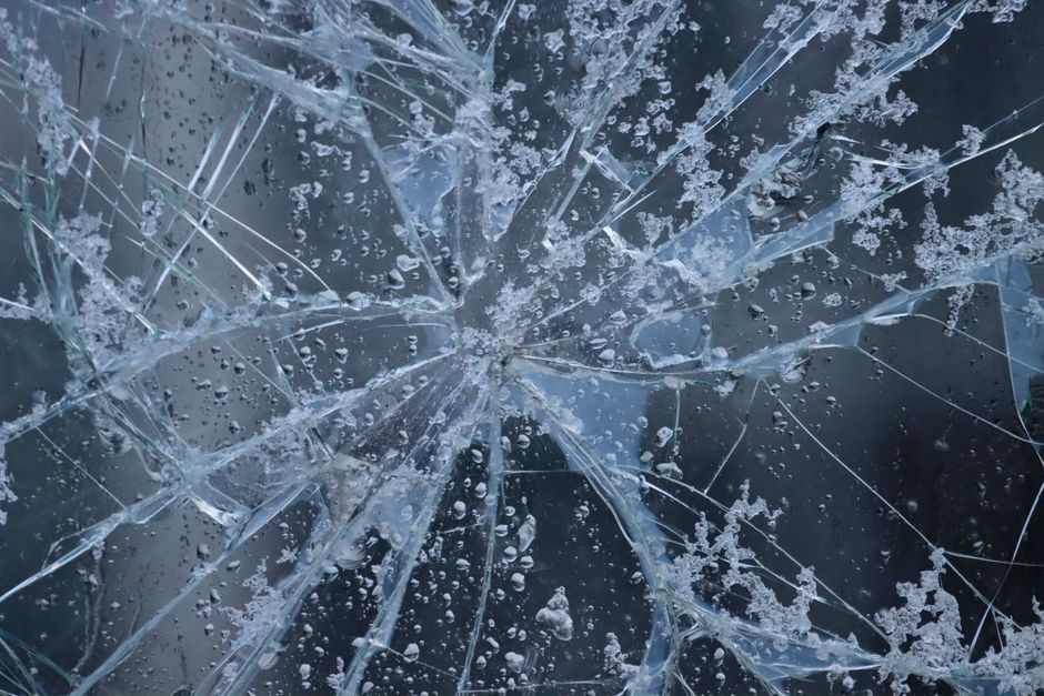 Cracked windshield glass requiring replacement